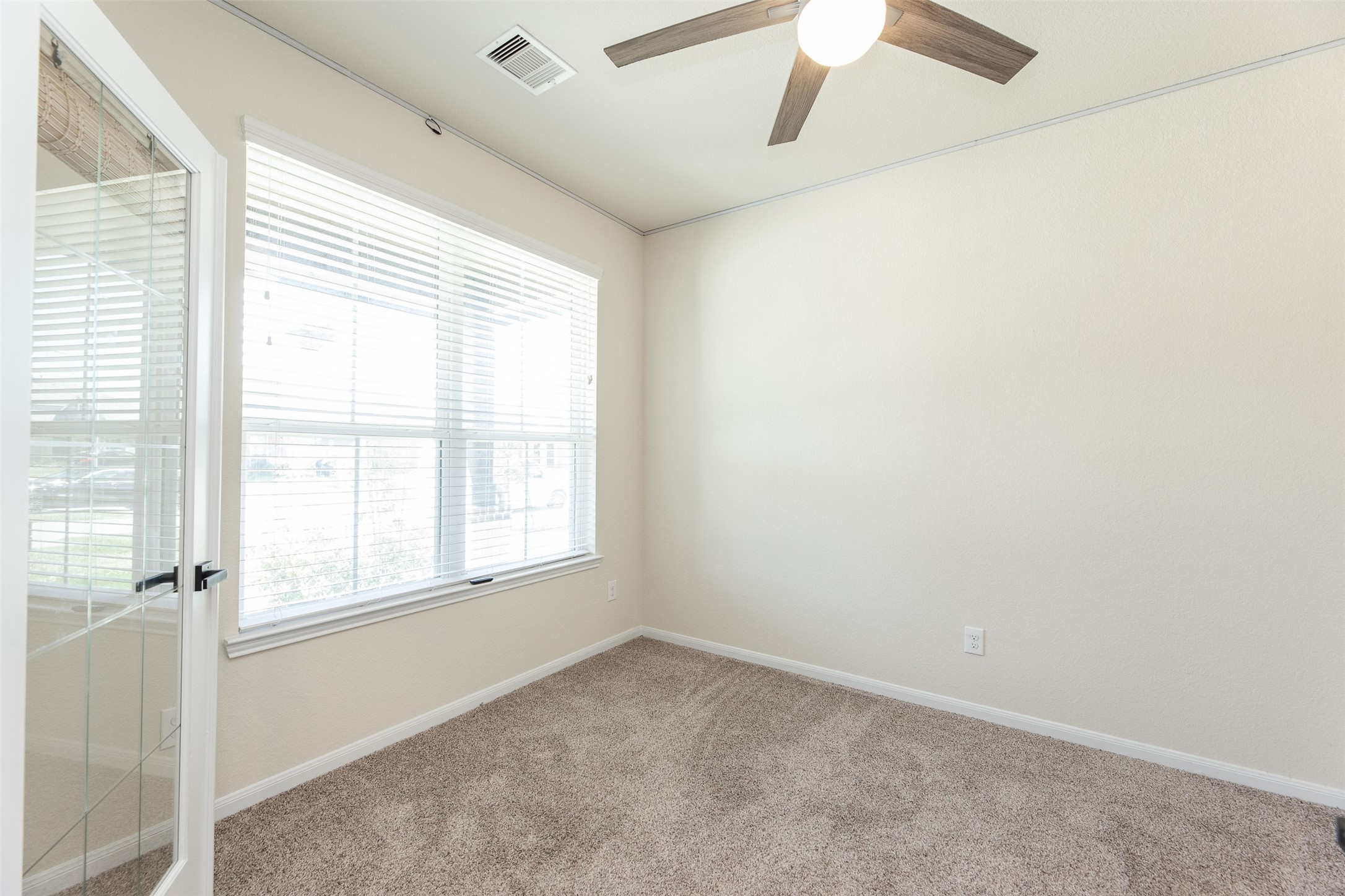 2293 Garden Square Path Spring, TX 77386 - Photo 6 of 32 an empty room with a window