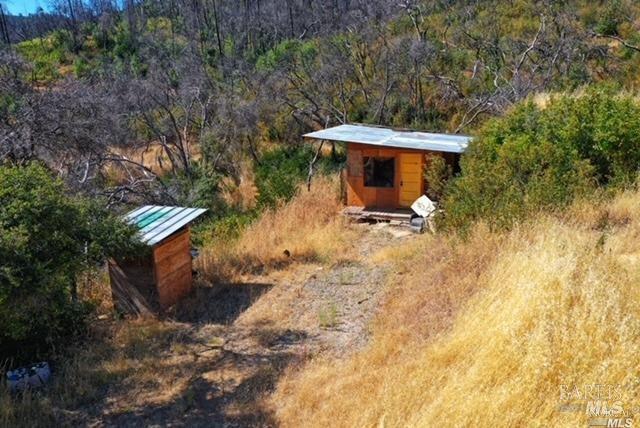 1525 Hunter Point Road Upper Lake, CA 95485 - Photo 5 of 6 a view of a backyard with a sink and a bench