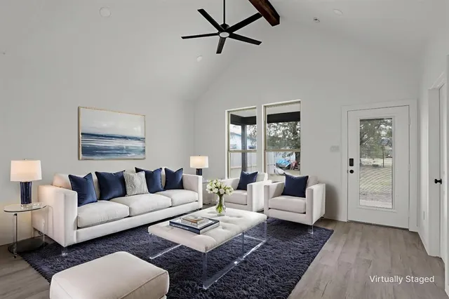 a living room with furniture or couch and a table