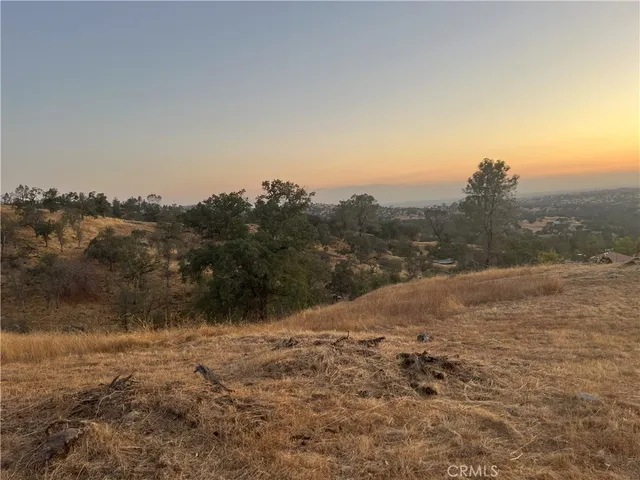 a view of a road with mountains in the background