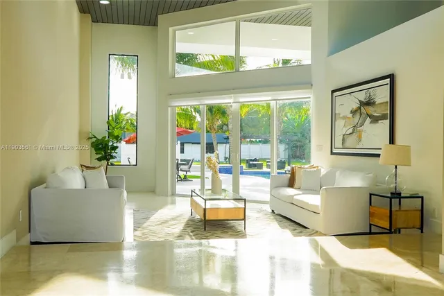 a large white bed sitting in a bedroom
