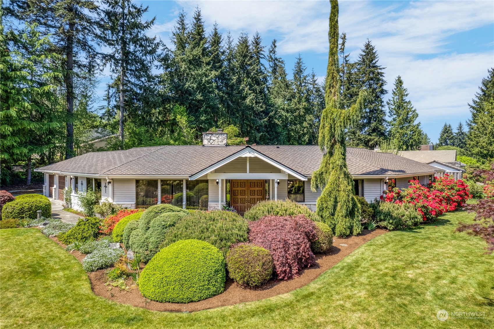 701 175th Street Southwest Bothell, WA 98012 - Photo 1 of 1 a front view of a house with a garden