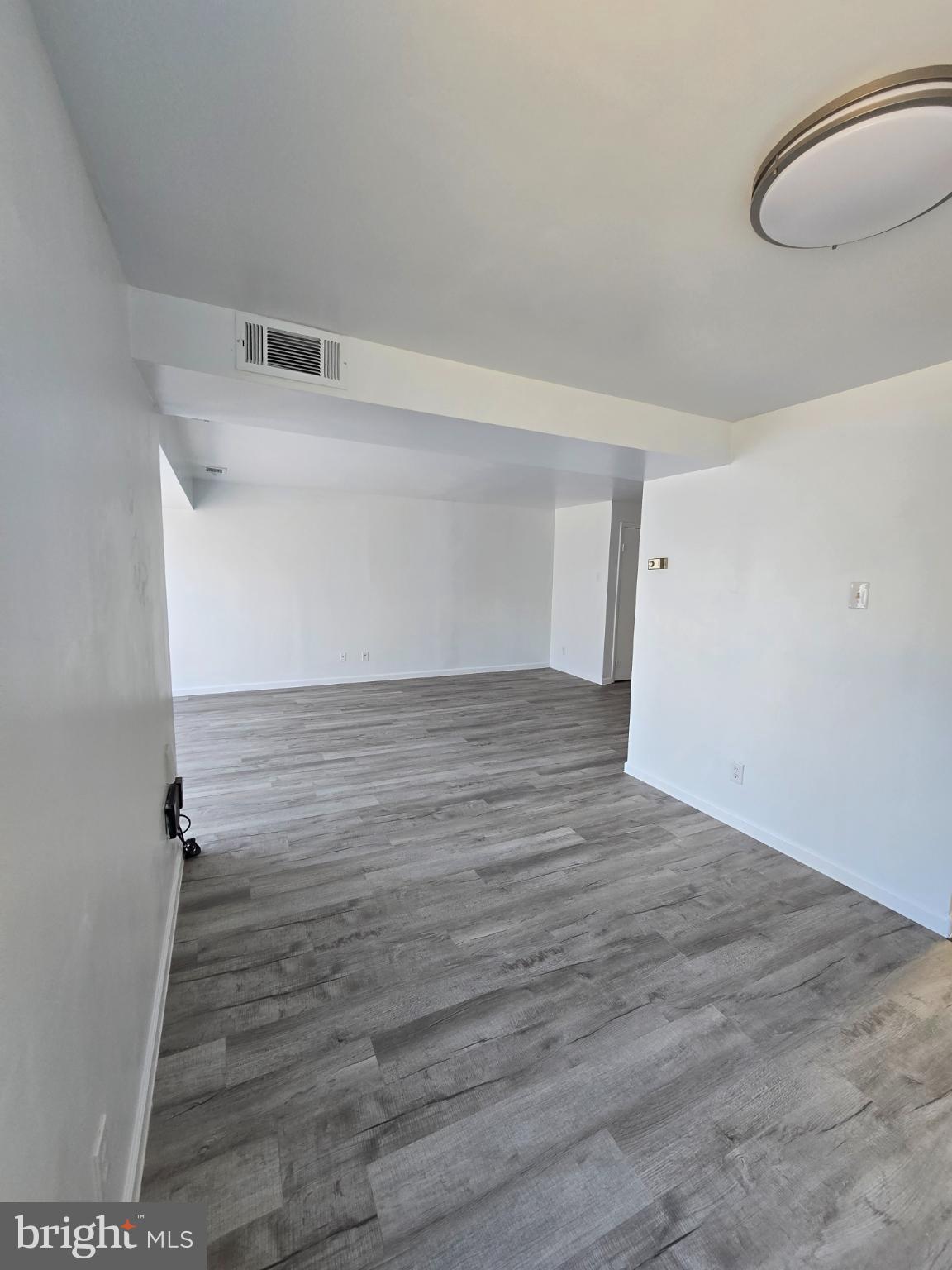 18901 Smoothstone Way, Unit I3 Gaithersburg, MD 20886 - Photo 11 of 36 a view of a room with wooden floor