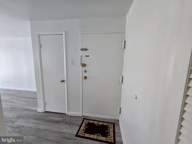 a room with a bench and a wooden floor