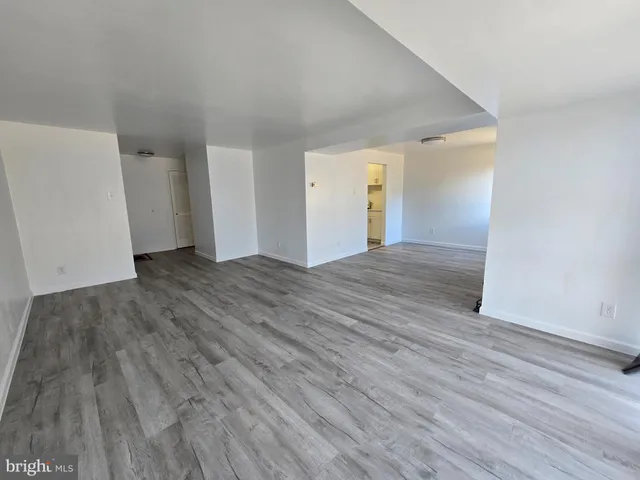 a view of a livingroom with wooden floor
