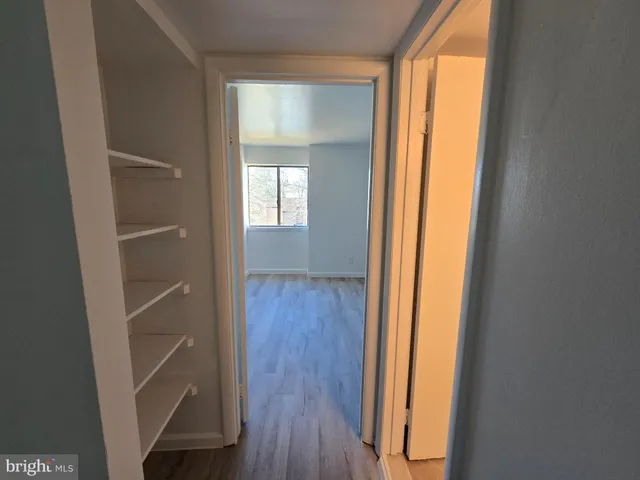 a view of front door with wooden floor