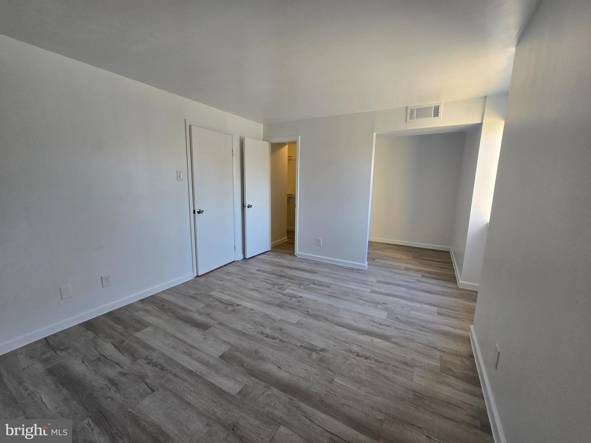 18901 Smoothstone Way, Unit I3 Gaithersburg, MD 20886 - Photo 30 of 36 a view of empty room with wooden floor