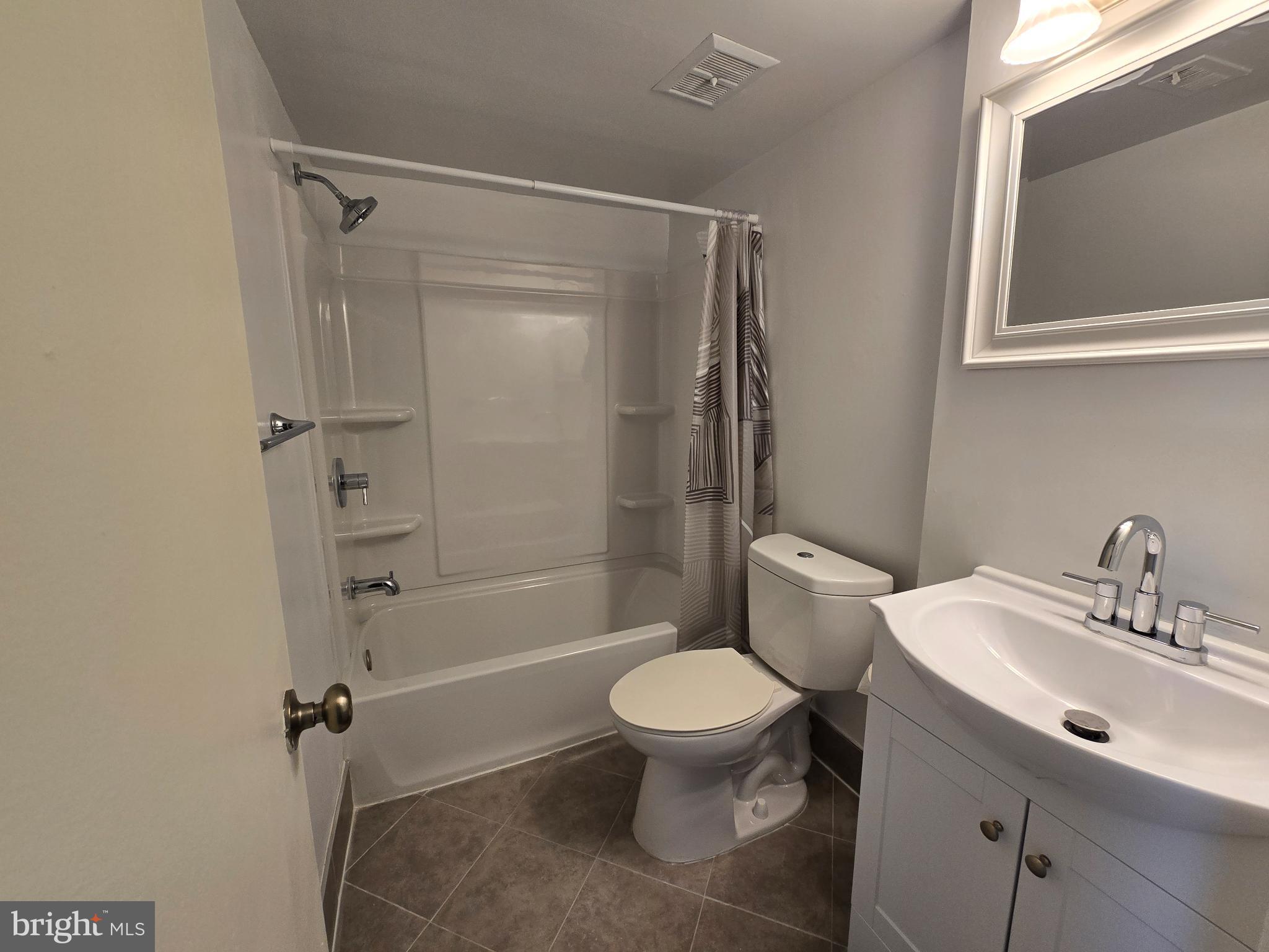 18901 Smoothstone Way, Unit I3 Gaithersburg, MD 20886 - Photo 36 of 36 a bathroom with a sink toilet and shower