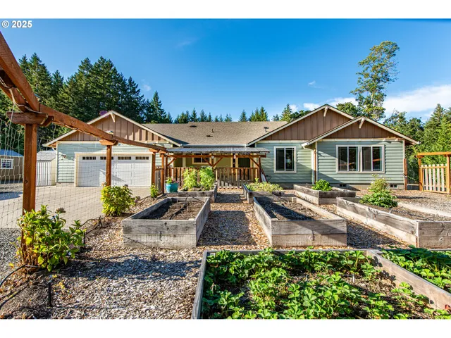 a front view of a house with garden