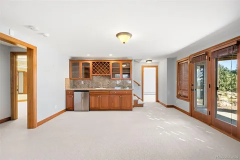 a spacious bedroom with a large bed and a large window