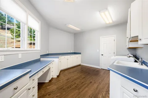 a room with a sink and a window