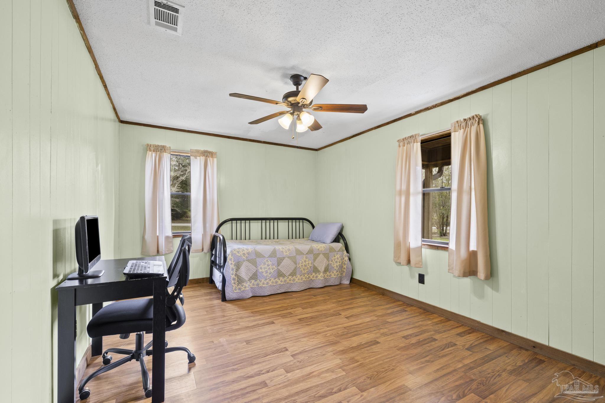 4960 Hyatt Lane Pace, FL 32571 - Photo 12 of 23 a living room with furniture and a chandelier