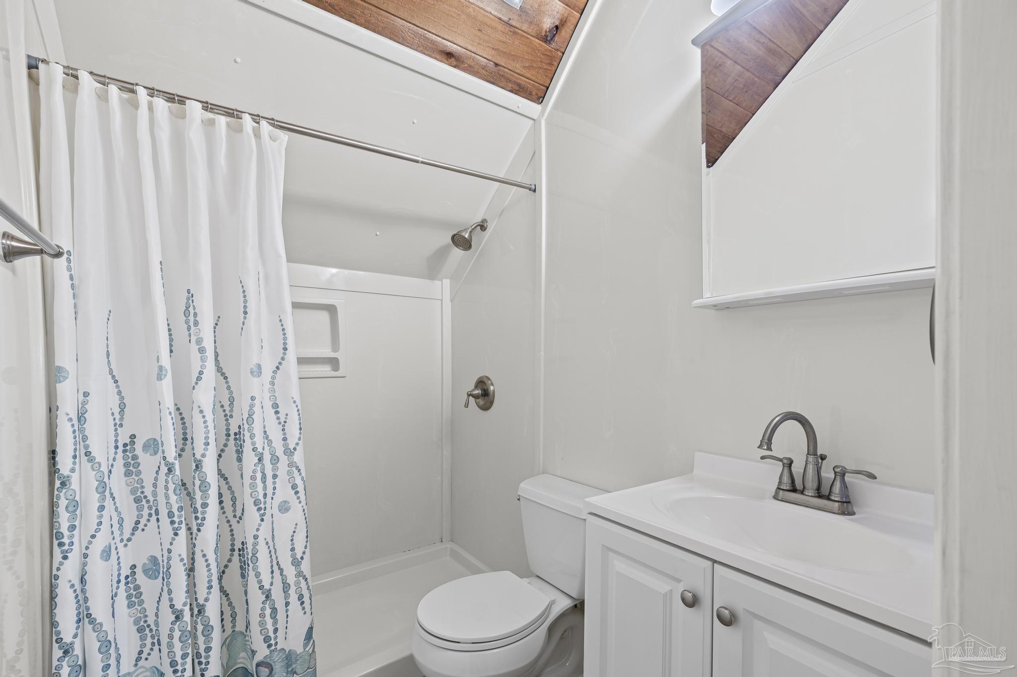 4960 Hyatt Lane Pace, FL 32571 - Photo 14 of 23 a bathroom with a sink a toilet and shower