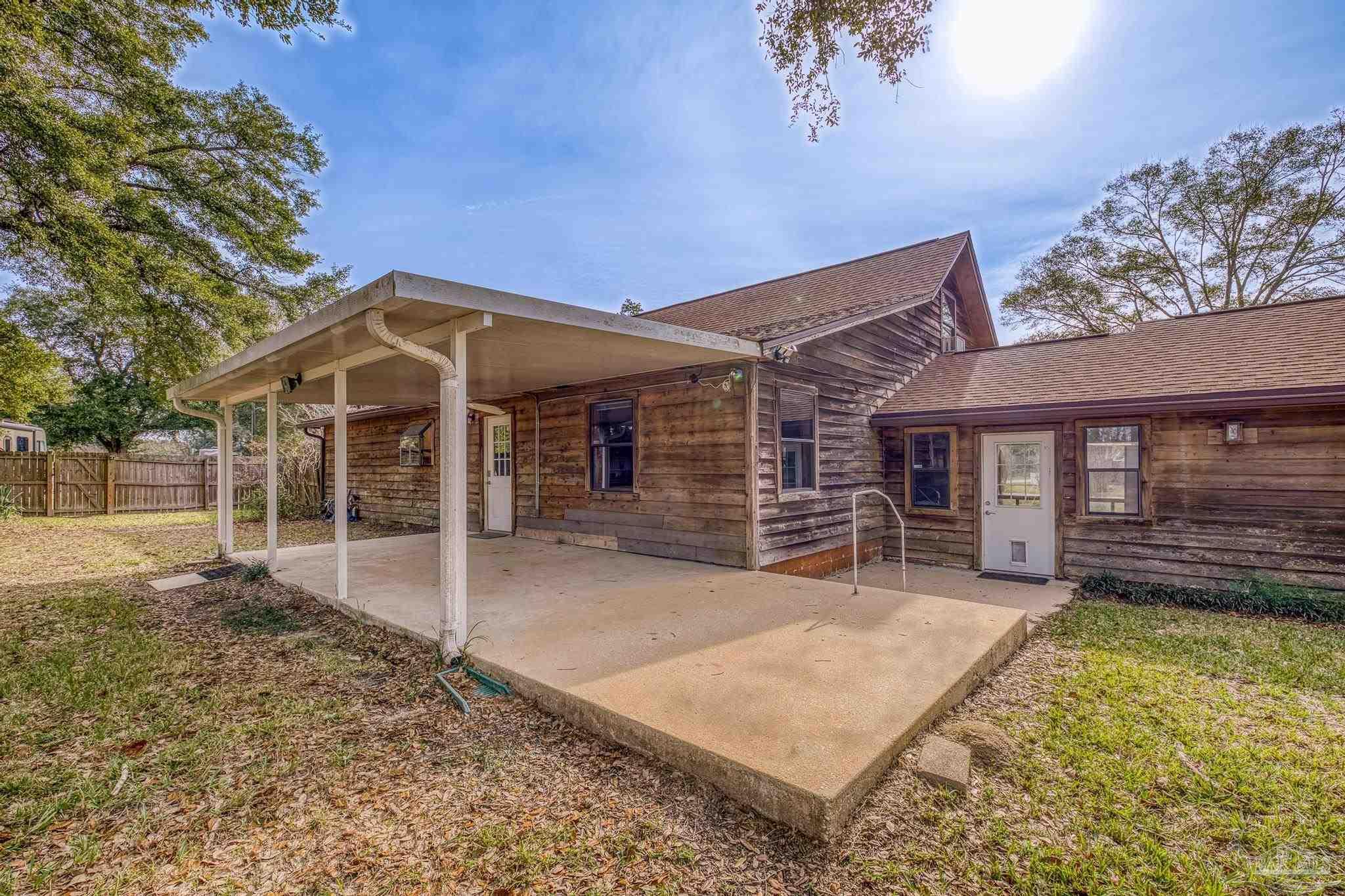 4960 Hyatt Lane Pace, FL 32571 - Photo 19 of 23 front view of a house with a yard