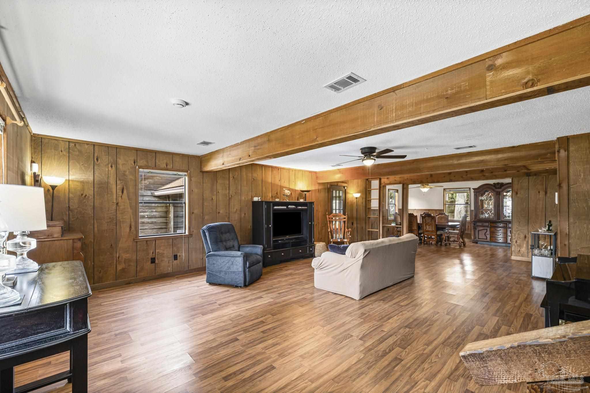 4960 Hyatt Lane Pace, FL 32571 - Photo 6 of 23 a living room with furniture and wooden floor