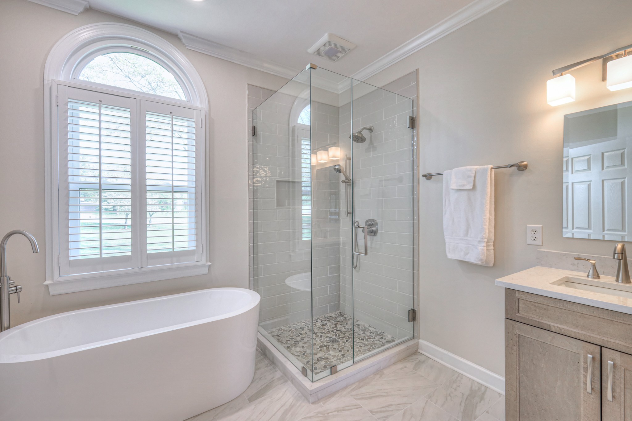 305 Eiderdown Court Franklin, TN 37064 - Photo 12 of 31 a bathroom with a bathtub a shower a sink and a window