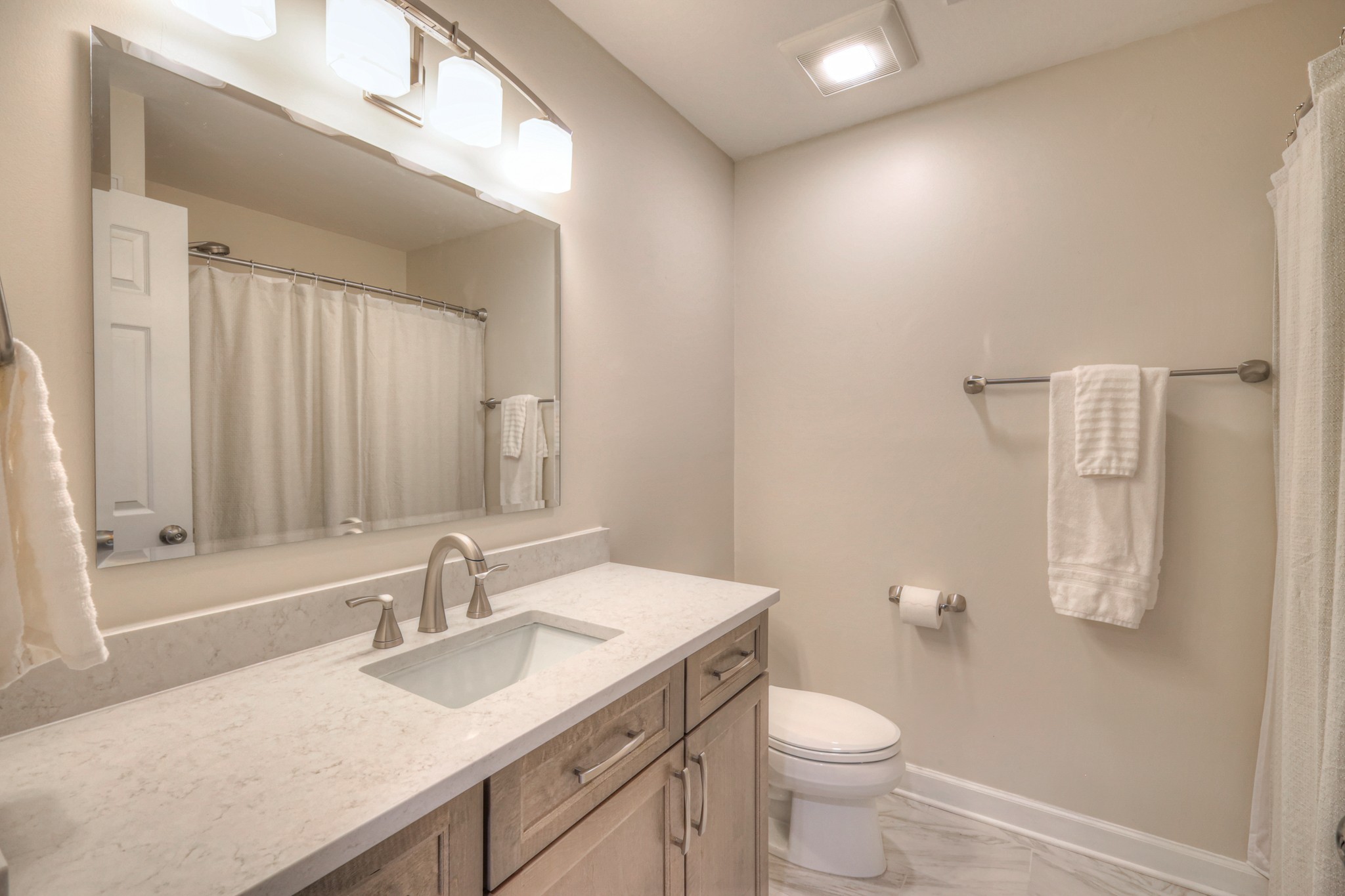 305 Eiderdown Court Franklin, TN 37064 - Photo 15 of 31 a bathroom with a granite countertop sink toilet and a mirror
