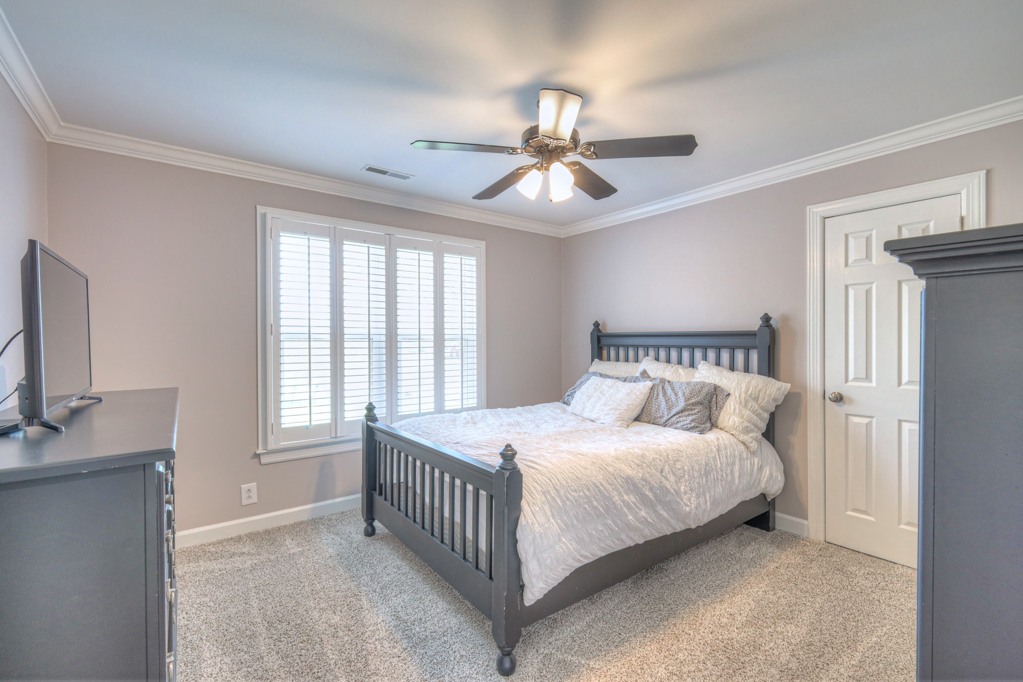 305 Eiderdown Court Franklin, TN 37064 - Photo 16 of 31 a bedroom with a bed and a chandelier