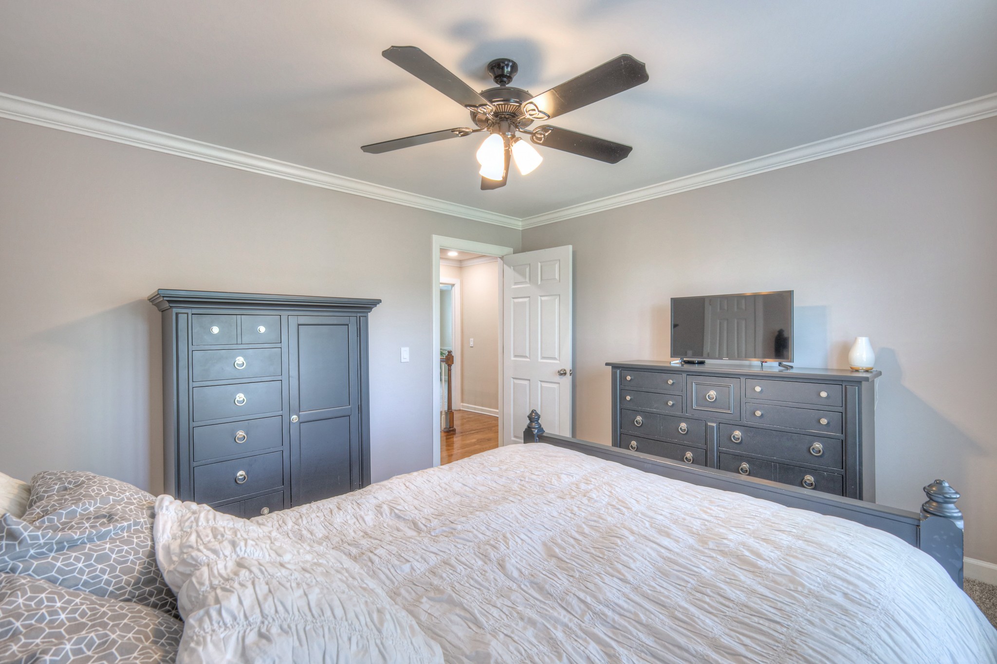 305 Eiderdown Court Franklin, TN 37064 - Photo 17 of 31 a bedroom with a bed and a dresser