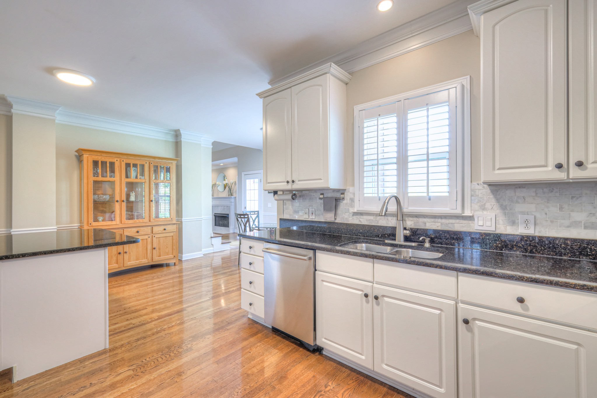 305 Eiderdown Court Franklin, TN 37064 - Photo 4 of 31 a kitchen with granite countertop white cabinets and a sink