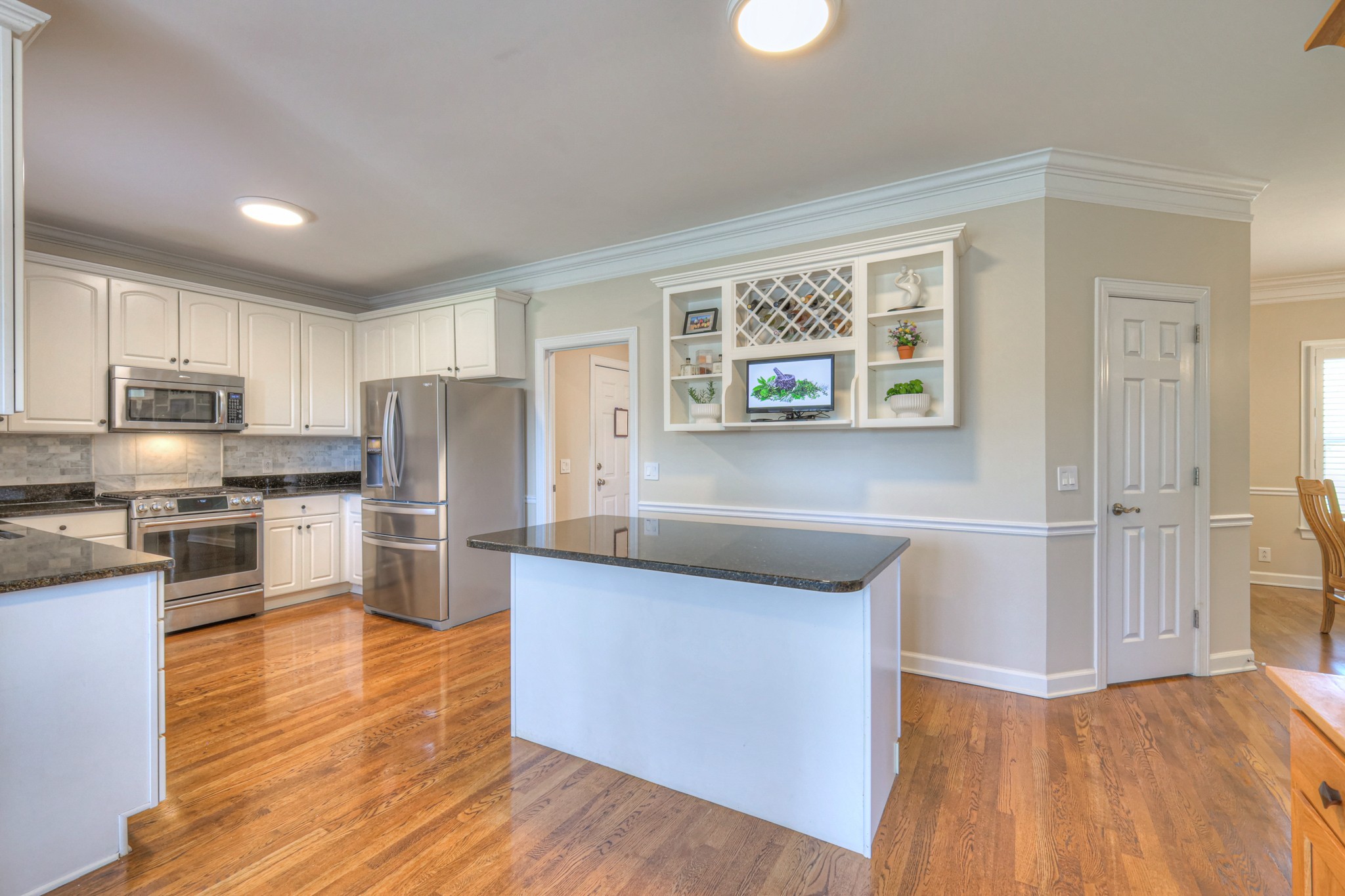 305 Eiderdown Court Franklin, TN 37064 - Photo 5 of 31 a kitchen with stainless steel appliances a refrigerator and a stove top oven