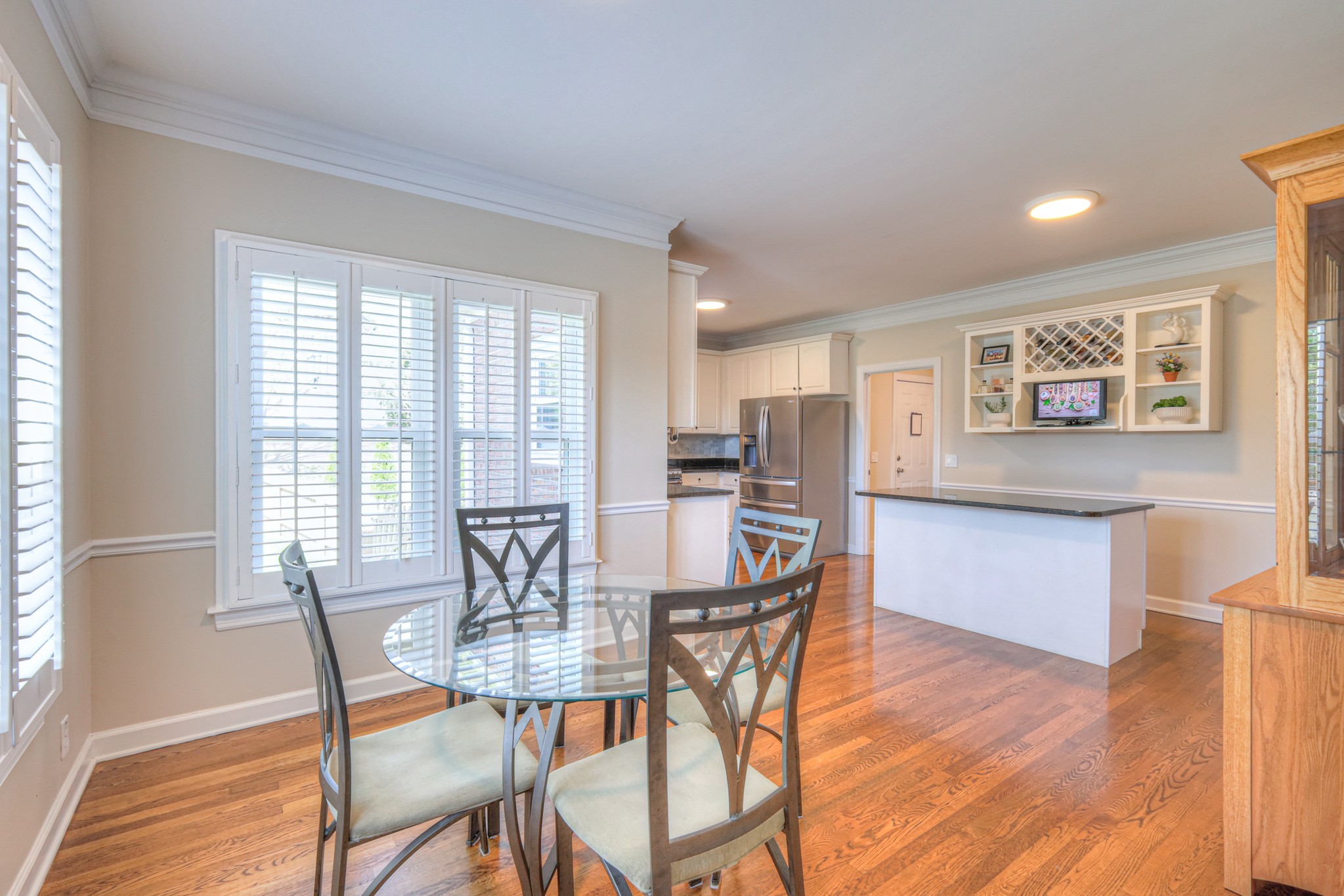 305 Eiderdown Court Franklin, TN 37064 - Photo 8 of 31 a dining room with furniture and wooden floor