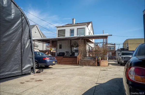 a view of car parked in front of house