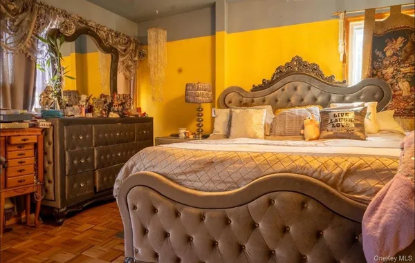 a view of a dining room with furniture and chandelier