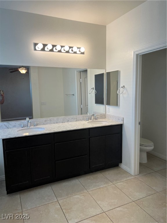 1070 Bobby Basin Avenue Henderson, NV 89014 - Photo 12 of 23 Full bathroom with double vanity and light tile patterned flooring