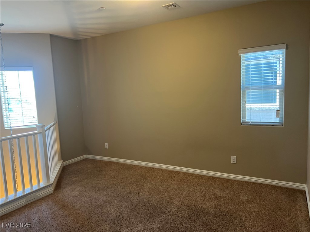 1070 Bobby Basin Avenue Henderson, NV 89014 - Photo 8 of 23 Unfurnished loft with carpet
