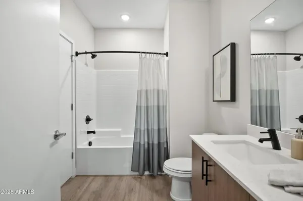 a view of a hallway with washer and dryer