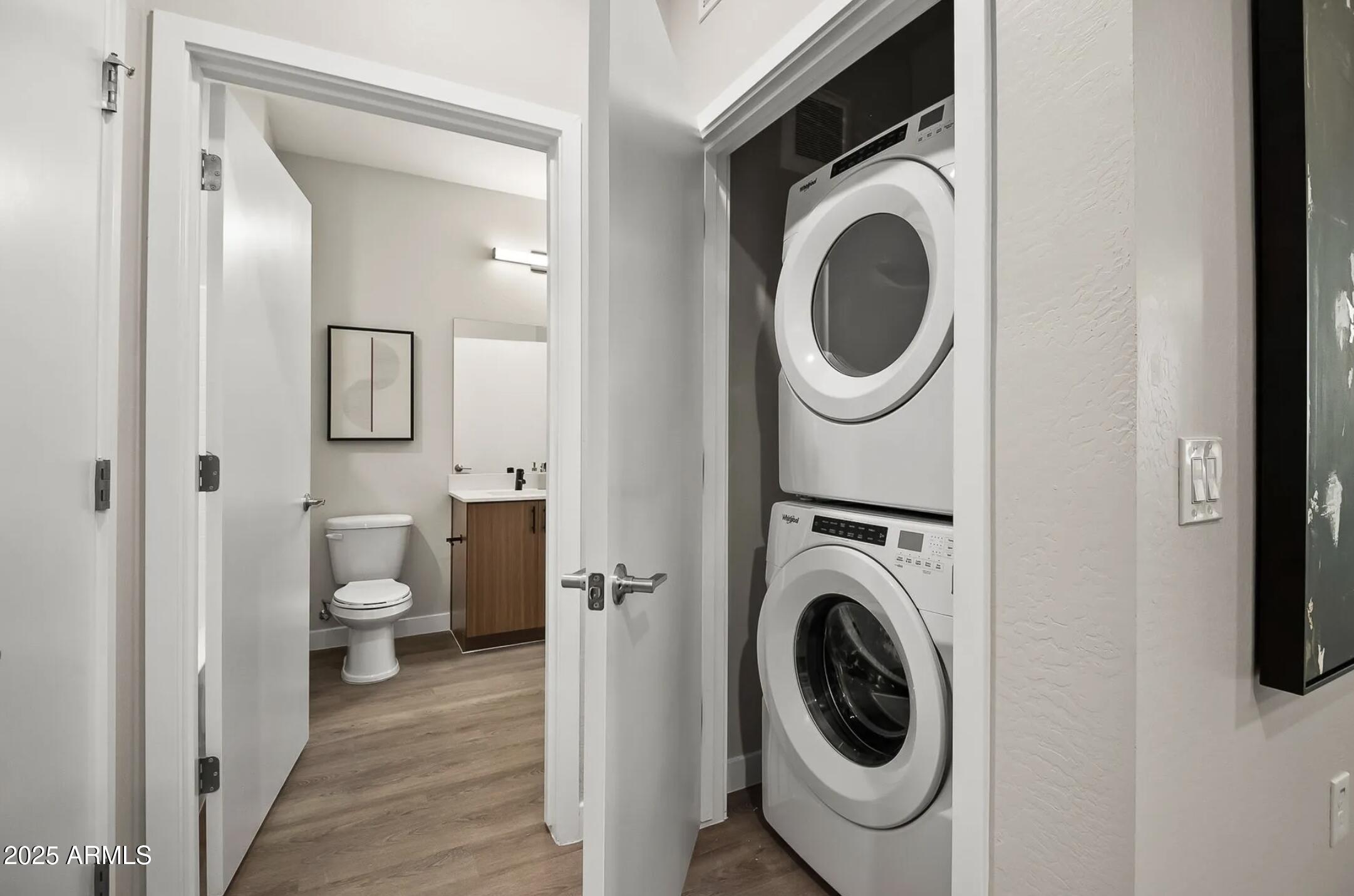 17445 West Lower Buckeye Road, Unit C1 Goodyear, AZ 85338 - Photo 10 of 35 a view of a hallway with washer and dryer