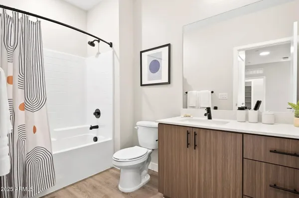 a view of a patio with a table and chairs and potted plants