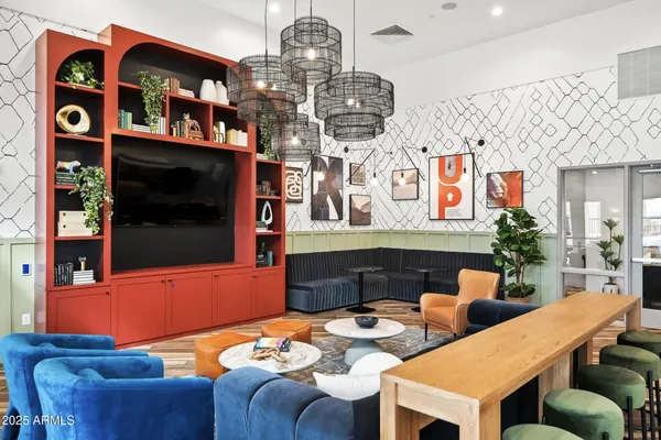 a kitchen with a sink and a stove with chairs