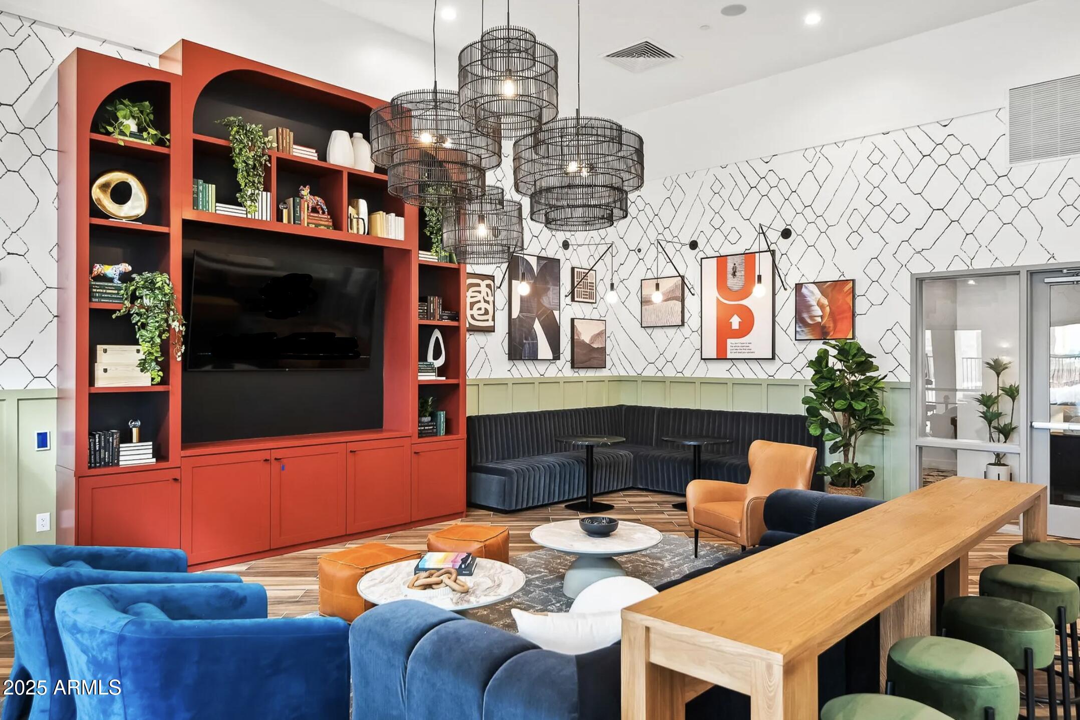 17445 West Lower Buckeye Road, Unit C1 Goodyear, AZ 85338 - Photo 19 of 35 a living room with furniture kitchen view and a chandelier