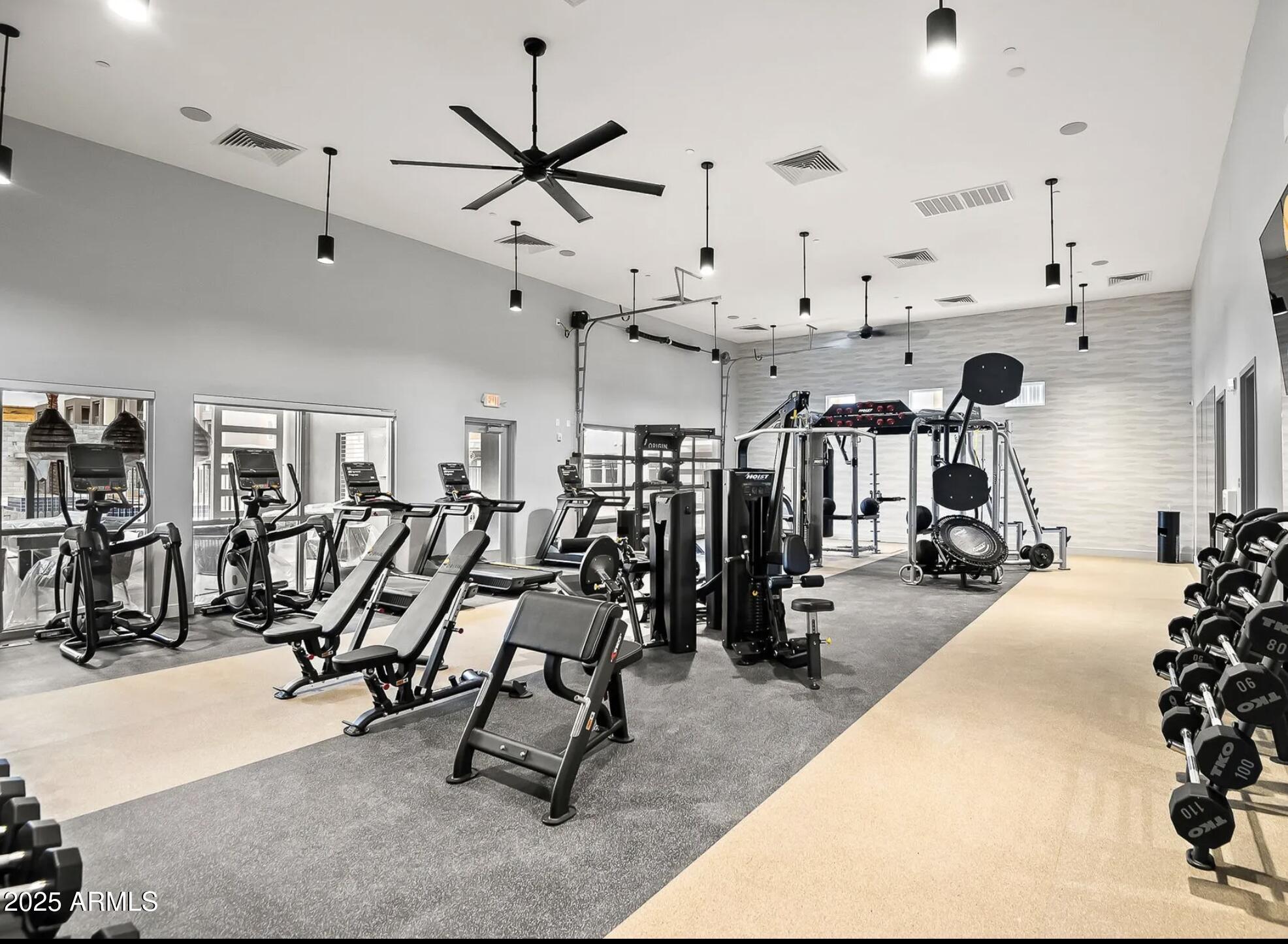 17445 West Lower Buckeye Road, Unit C1 Goodyear, AZ 85338 - Photo 25 of 35 a view of a room with gym equipment