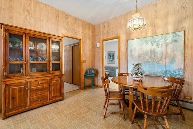 a dining room with furniture and window