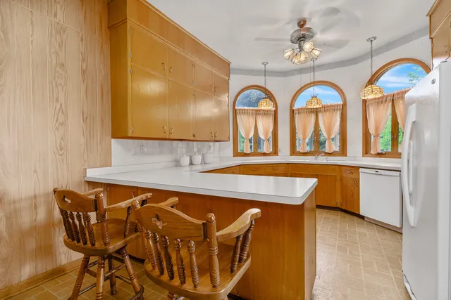 a view of a room with furniture and window