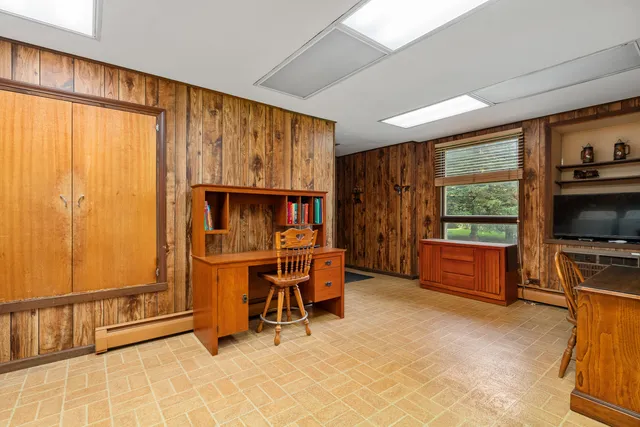 a bedroom with furniture and a window