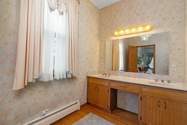 a bathroom with a sink and a mirror