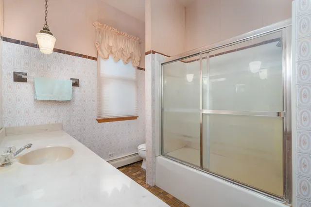 a bathroom with a sink and a shower