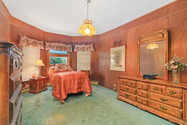 a bed room with a bed and a window