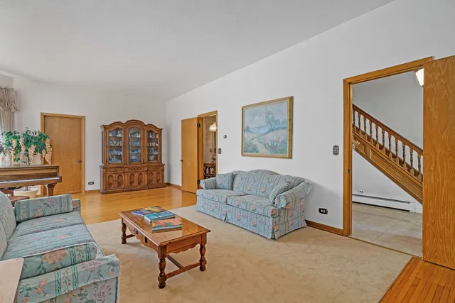 a living room with furniture and a rug