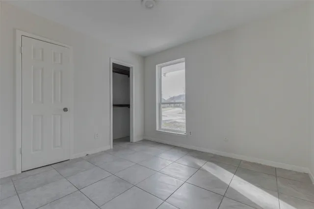 a bathroom with a granite countertop sink a toilet and bathtub
