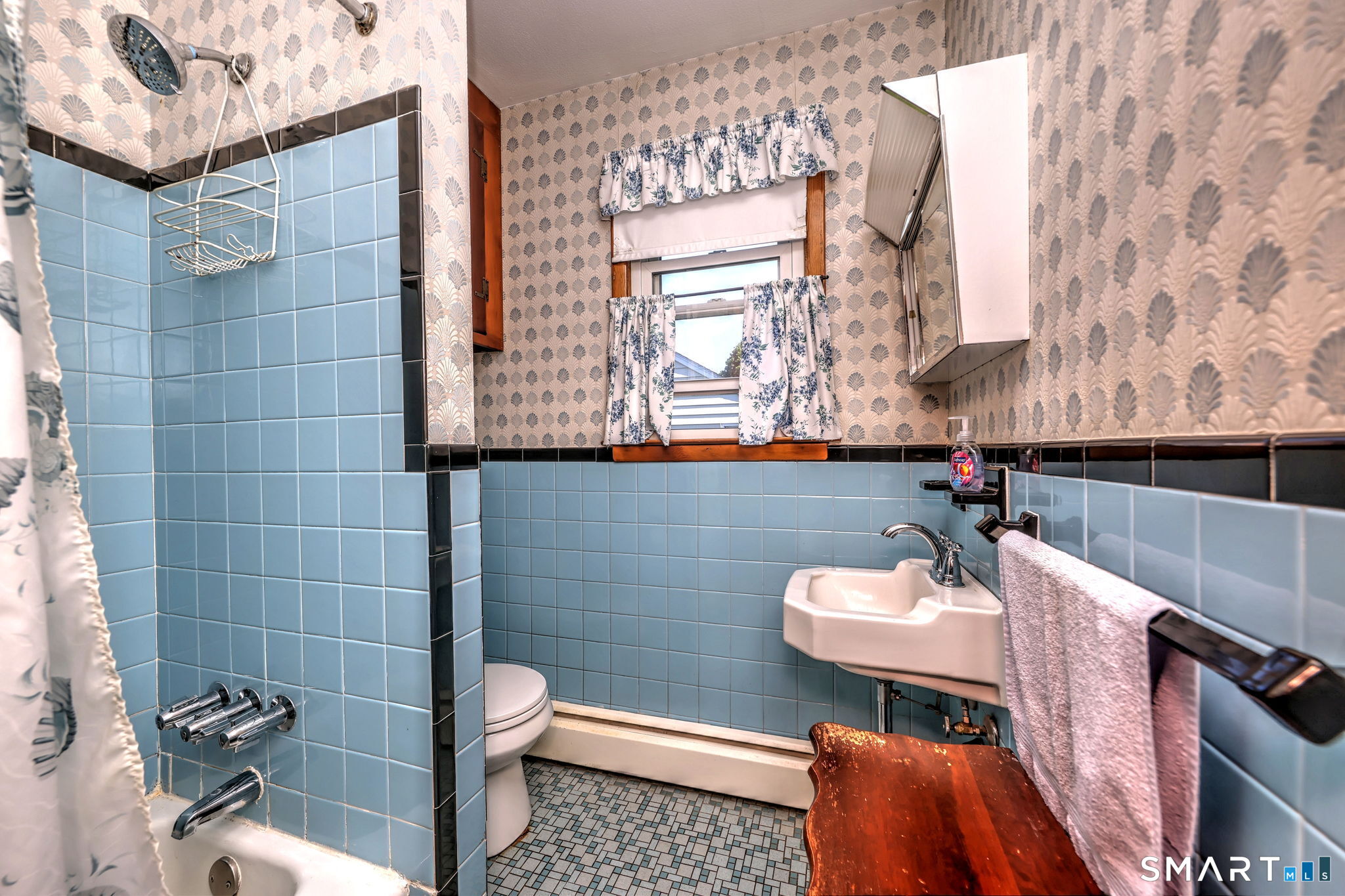 212 Swain Avenue Meriden, CT 06450 - Photo 33 of 38 a bathroom with a sink a toilet and a mirror