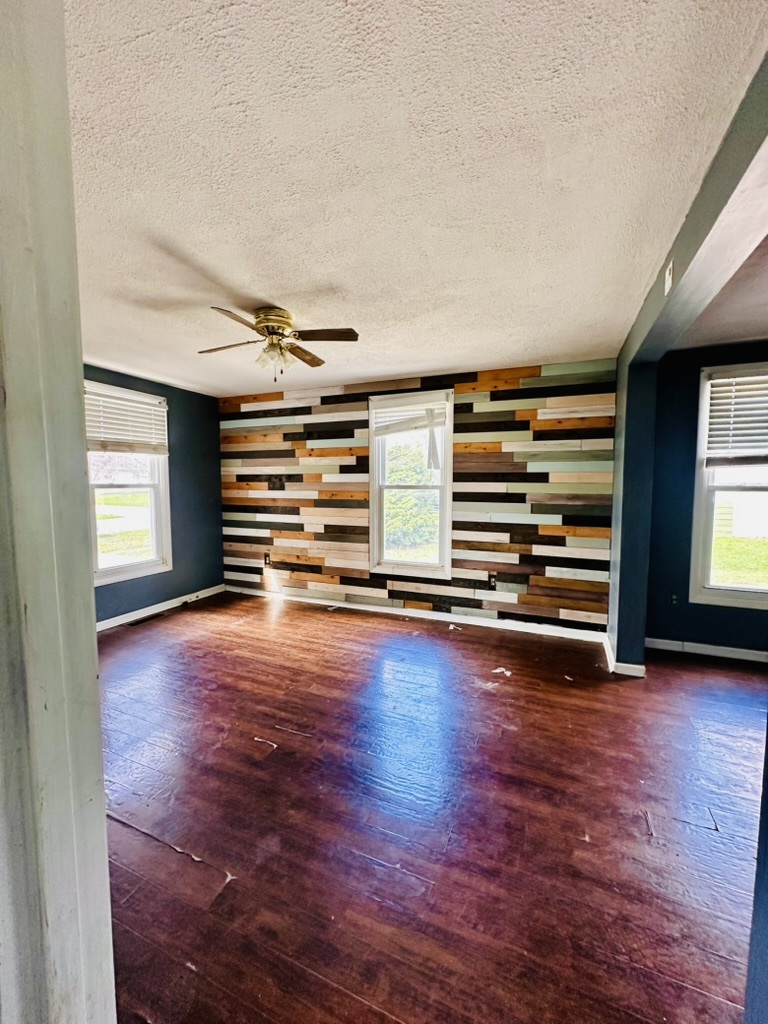 411 East Hamilton Street Odell, IL 60460 - Photo 12 of 19 a view of empty room with wooden floor and window