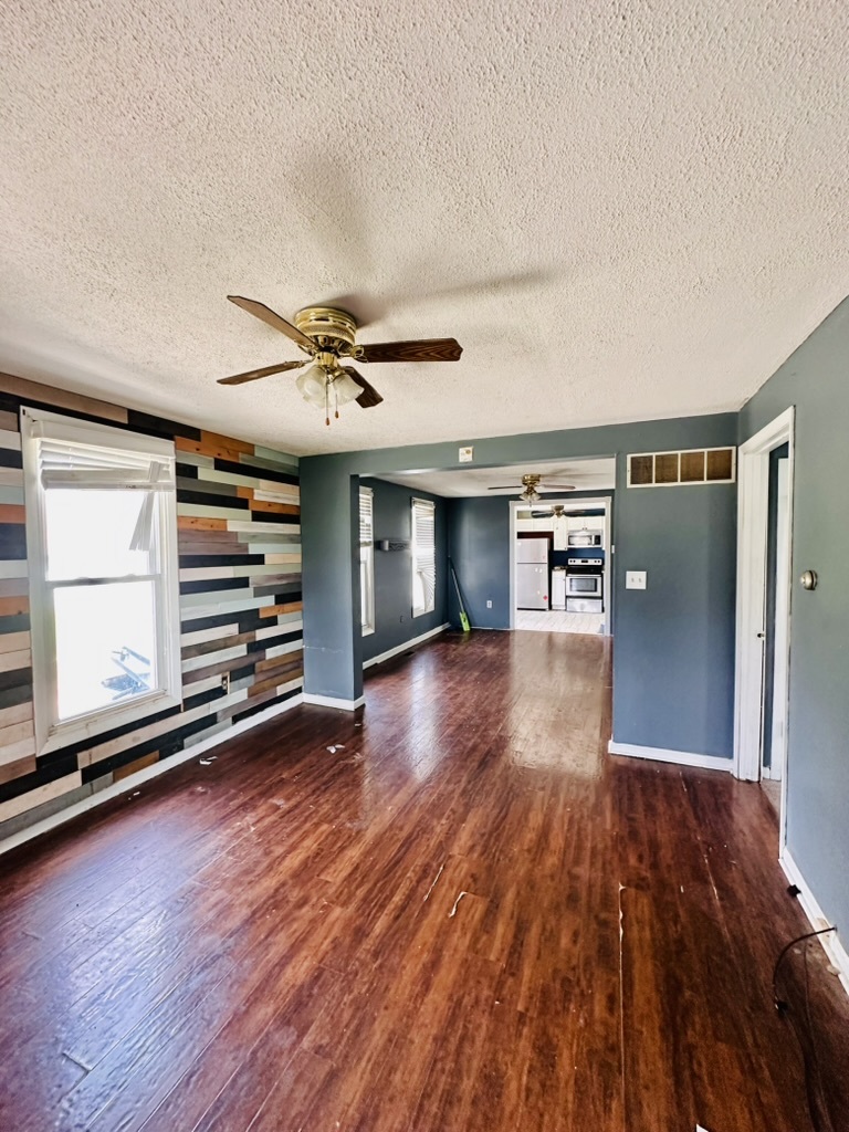 411 East Hamilton Street Odell, IL 60460 - Photo 14 of 19 wooden floor in an empty room with a window