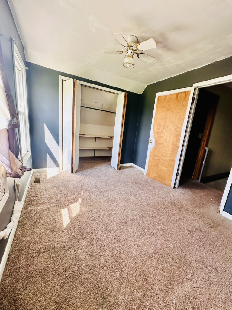 411 East Hamilton Street Odell, IL 60460 - Photo 16 of 19 a view of a bedroom with cabinet and mirror