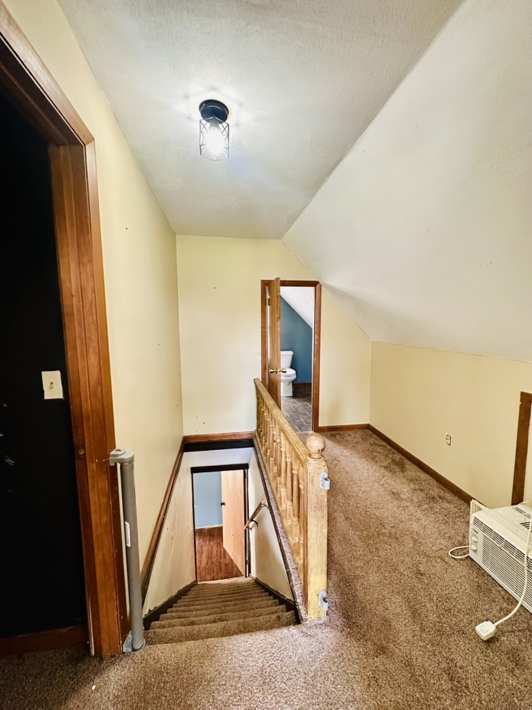 411 East Hamilton Street Odell, IL 60460 - Photo 17 of 19 a view of a hallway to a room with stairs
