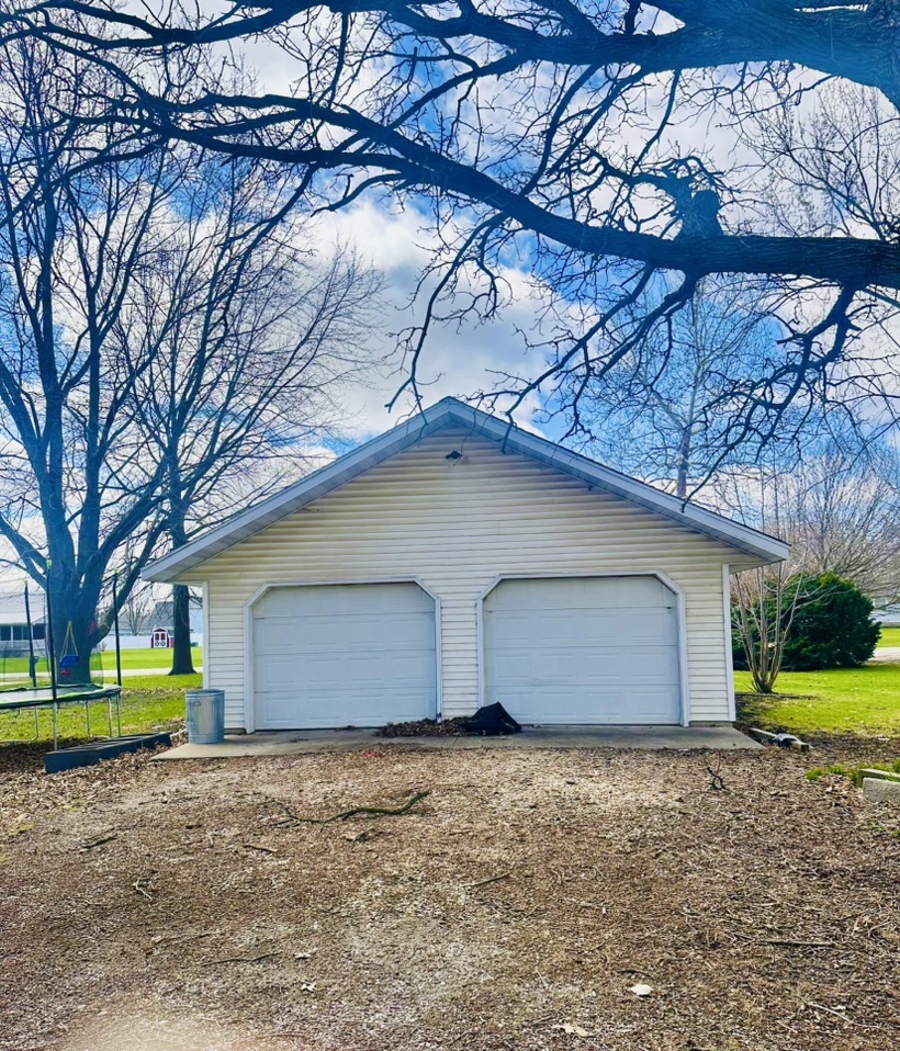 411 East Hamilton Street Odell, IL 60460 - Photo 3 of 19 a house with a yard and garage